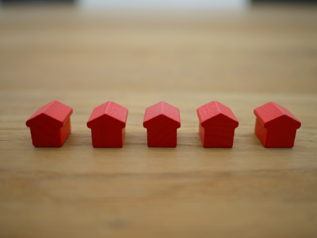 row of 5 small monopoly sized red houses